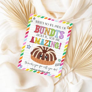 May include: A colorful card with the text "THERE'S NO IFS, ANDS, OR BUNDTS ABOUT IT... YOU ARE AMAZING!" features a cartoon bundt cake. The card has a lined paper background and a rainbow border. The text "thanks you for all you do!" is also included.