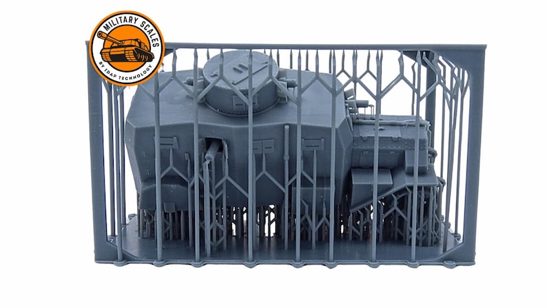 May include: A gray 3D printed model of a tank, enclosed in a cage-like structure. The tank has a large turret and a detailed design. The model is printed by "Military Scales by 3D-AP Technology".