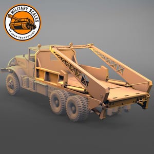 May include: A tan-colored model of a military truck with a large lifting mechanism. The truck has six wheels and a detailed design, with the "MILITARY SCALES" logo in the upper left corner.