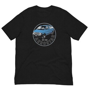 May include: A black t-shirt with a white circle graphic featuring a blue Ford Aerostar minivan with the text "Aerostar Est. 1993".
