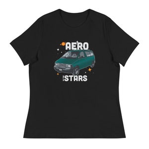 May include: A black t-shirt featuring a green van with the text "Aero in the Stars" printed on it. The van has a white roof and white trim. There are stars and planets around the van.