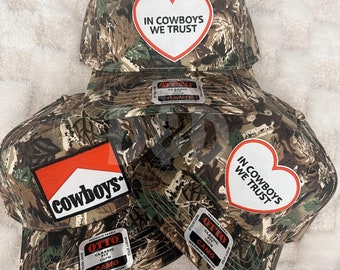 In Cowboys We Trust Camo Trucker Patch Hat, Iron Patches, Cowgirl Trucker Hat, Woman’s Trucker Hat, Camo Trucker Hat With Patches