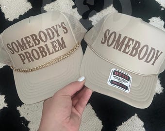 Somebody’s Problem Trucker Hat: Tan Country Concert Hat with Charm