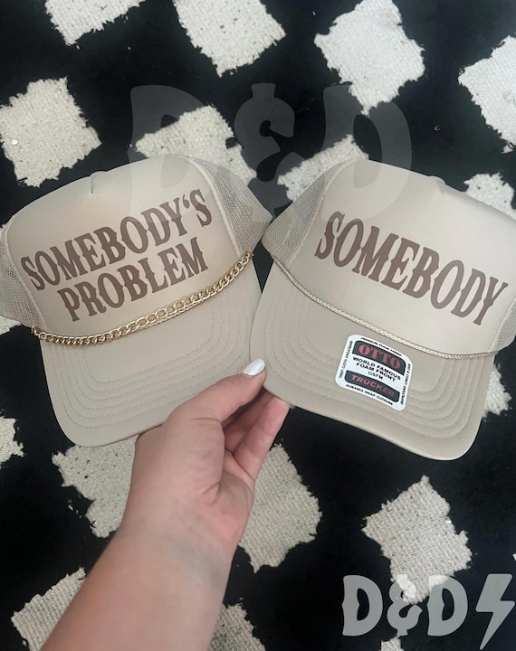 Somebody’s Problem Trucker Hat: Tan Country Concert Hat with Charm