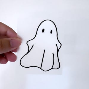 Könnte beinhalten: Eine einfache Schwarzweißzeichnung eines Gespenstes mit zwei Augen auf weißem Hintergrund.