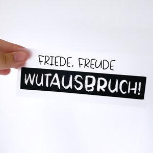 Könnte beinhalten: Eine weiße Karte mit schwarzem Text, der "FRIEDE, FREUDE WUTAUSBRUCH!" lautet.