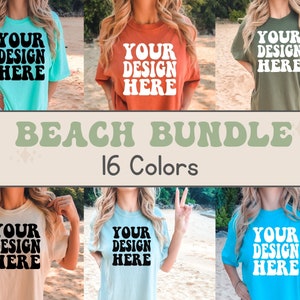 May include: A mockup of 16 different colored t-shirts with the text "YOUR DESIGN HERE" printed on the front. The t-shirts are displayed on models in a beach setting. The text "BEACH BUNDLE 16 Colors" is displayed in a banner at the bottom of the image.