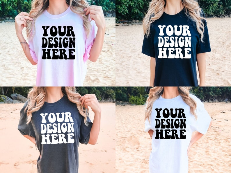 May include: Four different color t-shirts with the text "YOUR DESIGN HERE" printed in black on the front. The shirts are shown on models in a beach setting.
