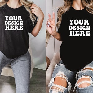 May include: Two women wearing black t-shirts with the text "YOUR DESIGN HERE" in white. The women are wearing different styles of jeans.