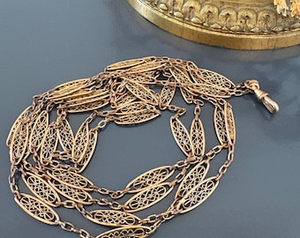 Cadena larga antigua de 56 pulgadas para reloj de bolsillo, chapada en oro, circa 1900.