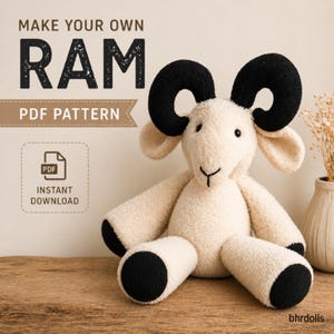 May include: A cream-coloured plush ram toy with black horns and hooves. The soft toy is sitting on a wooden surface. The image includes text that reads "MAKE YOUR OWN RAM PDF PATTERN" and "INSTANT DOWNLOAD".