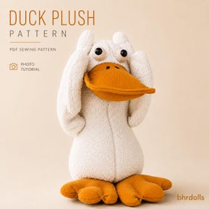 May include: A plush duck toy with cream-coloured fabric, a large orange beak, and orange webbed feet. The duck has black button eyes and its wings are raised to its head. Text reads: DUCK PLUSH PATTERN, PDF SEWING PATTERN, PHOTO TUTORIAL, bhrdolls.