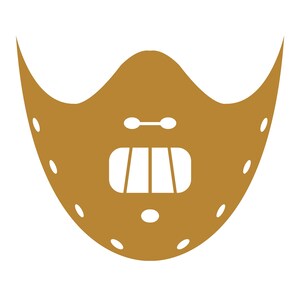 May include: A gold-colored, leather-like mask with a metal mouth guard and a strap across the top. The mask has a series of small holes around the edges.
