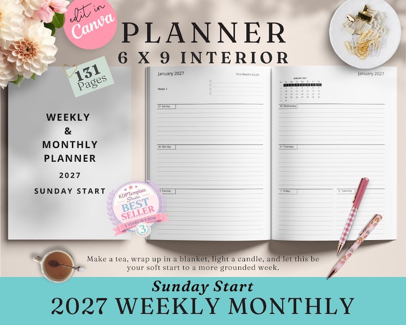 May include: An open 6 x 9 inch planner with a weekly and monthly layout for 2027. The cover reads "Planner" and "Sunday Start." The interior pages are lined for notes. Two pens and a cup of tea are on the table.