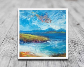 May include: A painting of a seascape with a blue sky, white clouds, and a green grassy hill in the foreground. The water is a deep blue and there are mountains in the distance.