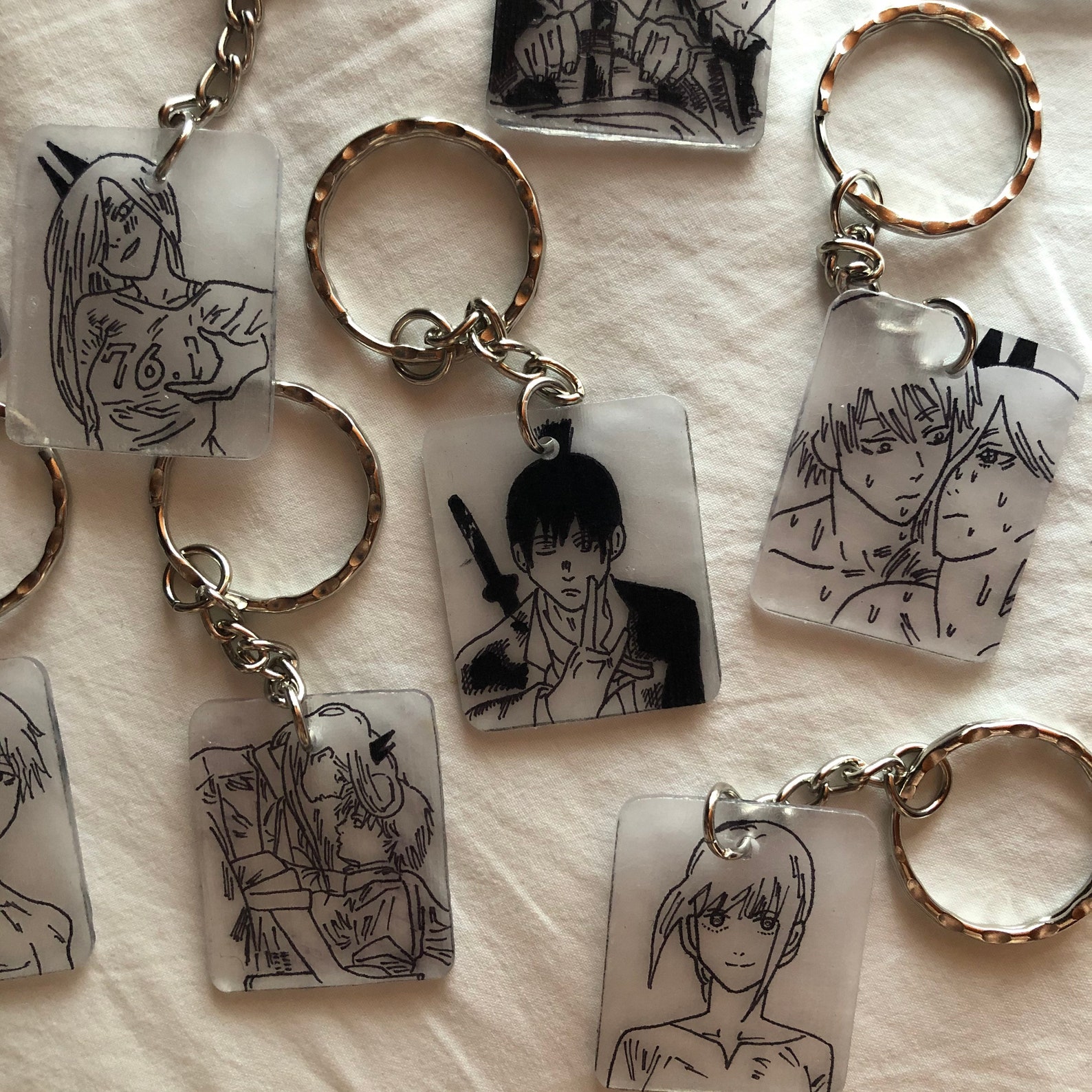 Chainsaw man keychains with two spotify codes and logo on Etsy