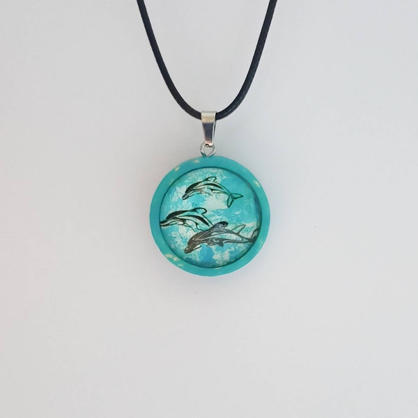 Collier câble pendentif cabochon bleu dauphins