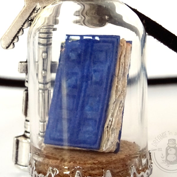 Diary of River, miniature blue book in a glass bottle pendant with silver tone charms