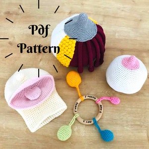 Puede incluir: Un conjunto de juguetes para bebés de crochet, que incluye un sonajero, un mordedor y un gorro. Los juguetes están hechos en una variedad de colores, incluyendo rosa, amarillo, azul, verde y blanco. Los juguetes están diseñados para ser seguros para los bebés y son perfectos para estimular sus sentidos.