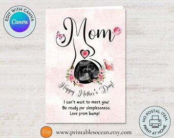 May include: Pink and white card with a black and white ultrasound image inside a heart shape with flowers and butterflies. The text on the card reads "Mom" and "Happy Mother's Day! I can't wait to meet you! Be ready for sleeplessness. Love from bump!"