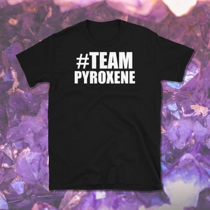 May include: Black t-shirt with white text that reads "#TEAM PYROXENE"