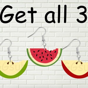 May include: Three pairs of dangle earrings featuring a bite taken out of a fruit. The earrings are watermelon, apple, and a green apple. The text "Get all 3" is at the top of the image.