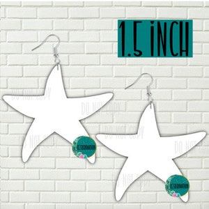 May include: Two blank white 1.5 inch starfish earrings with silver hooks. The earrings are on a white brick background.