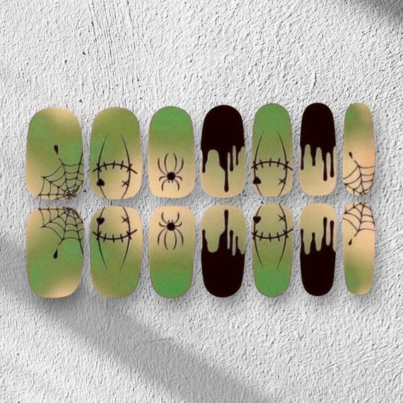 20 Halloween Nail Ideas With Ghosts, Bats and Spooky Details 9 Green Spiderweb Wraps