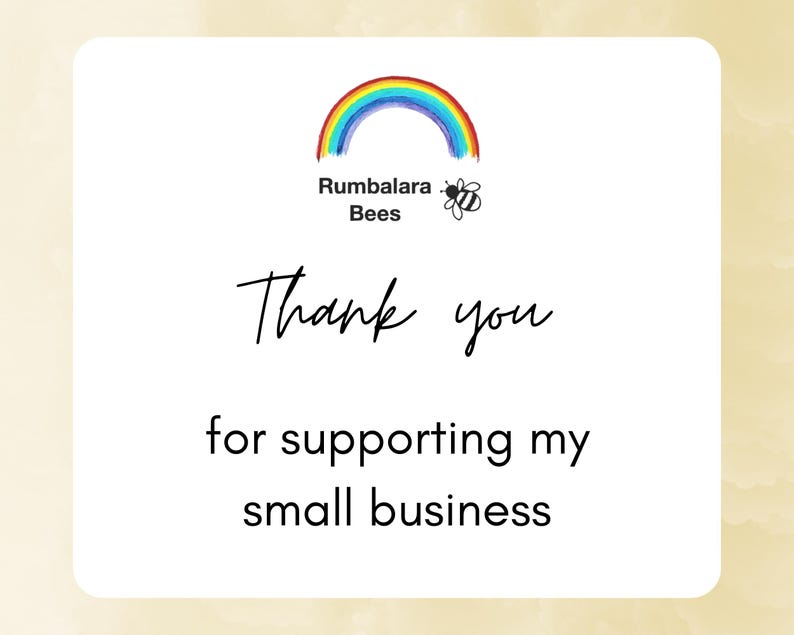 May include: A white thank you card with a rainbow and bee logo that says "Rumballara Bees". The card says "Thank you for supporting my small business."