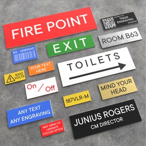 May include: A selection of rectangular signs with different text and designs. Signs include "FIRE POINT", "EXIT", "TOILETS", "ROOM B63", "MIND YOUR HEAD", and "JUNIUS ROGERS CM DIRECTOR". Other signs feature barcodes, warnings, and customisable text options.