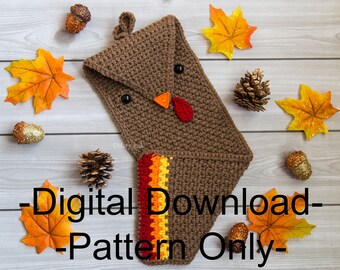 May include: A brown crocheted turkey stocking with a red, orange, and yellow striped cuff. The stocking is surrounded by fall leaves and pine cones. The text "Digital Download - Pattern Only" is printed on the image.