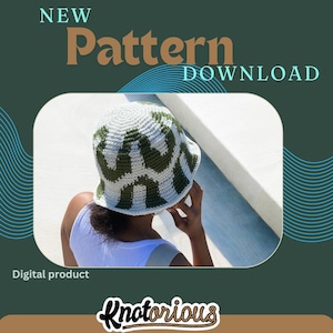 May include: A white and green crochet bucket hat with a geometric pattern. The hat is being worn by a person. The text "NEW Pattern DOWNLOAD" is at the top of the image. The text "Digital product" is at the bottom of the image. The text "Knotorious" is at the bottom of the image.