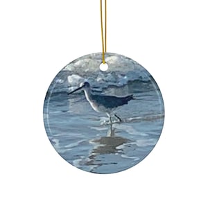 Christmas Ornament featuring an Oyster Catcher in the Hilton Head Island Surf