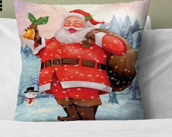 May include: A red and white Santa Claus with a white beard and a brown bag over his shoulder. He is holding a bell and a sprig of holly. He is standing in a snowy forest with a snowman in the background.