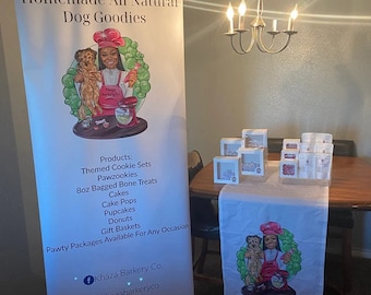 May include: A white banner with the text "Homemade All Natural Dog Goodies" and a cartoon image of a person baking dog treats. The banner also lists various dog treat products, including themed cookie sets, pawzookies, 8oz bagged bone treats, cakes, cake pops, pupcakes, donuts, and gift baskets. The banner also includes social media icons for Facebook and Instagram.