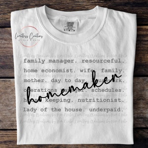 May include: White t-shirt with black text that reads "family manager, resourceful, home economist, wife, family, mother, day to day, homemaker, operations manager, schedules, housekeeping, nutritionist, lady of the house, underpaid."
