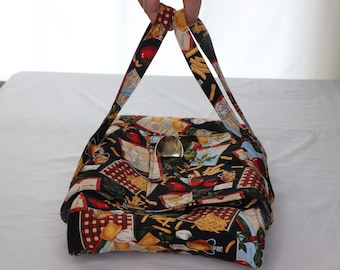 May include: A rectangular handbag with a black background and a repeating pattern of pasta, tomatoes, and other Italian food items. The bag has a gold-colored clasp and matching handles.