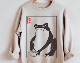 Sudadera unisex Grumpy Frog - Arte vintage, estética japonesa, estilo cottagecore - Matsumoto Hoji Design