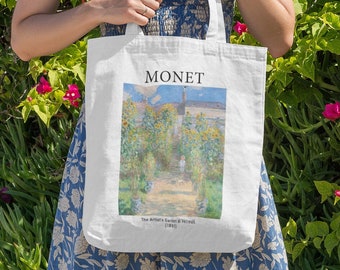 May include: White tote bag with a print of Claude Monet's "The Artist's Garden at Vétheuil (1881)". The bag has the word "MONET" printed in black. The bag is held by a person in a blue floral dress, with green foliage and pink flowers in the background.