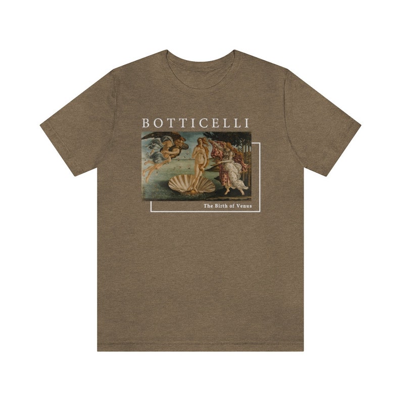 May include: A brown t-shirt with a white print of Sandro Botticelli's "The Birth of Venus" painting. The print includes the title of the painting and the artist's name.