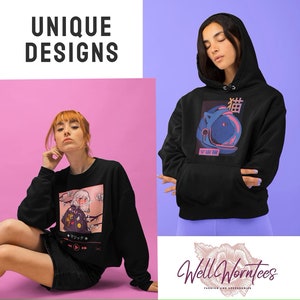 May include: Two women wearing black sweatshirts with unique graphic designs. One sweatshirt features a pink and blue astronaut cat with Japanese text. The other sweatshirt features a pink and white illustration of a woman with a cherry blossom background and the text "マジック".