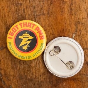 J'ai ce badge en PMA de 25 mm