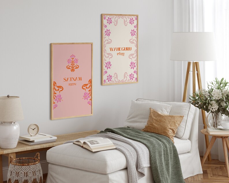 May include: Two framed prints with floral designs and text in orange and pink. The print on the left says "Satnam" in orange with a floral design in pink. The print on the right says "Waheguru" in orange with a floral design in pink.