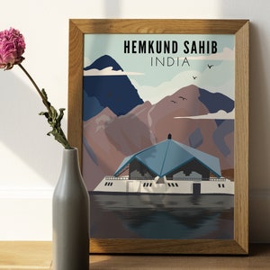 May include: A vintage travel poster with a blue and white illustration of a building in front of mountains. The text on the poster reads "Hemkund Sahib, India".