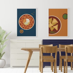 May include: Two framed illustrations of Indian food. The first illustration shows a plate of jalebi with a white sweet on top, surrounded by a red sauce. The second illustration shows a plate of samosas with a green chutney on the side.