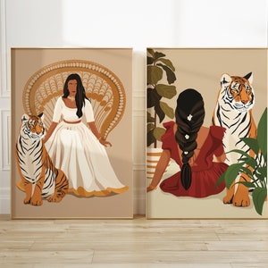 May include: Two digital art prints featuring women with tigers. The first print shows a woman in a white dress sitting on a wicker chair with a tiger beside her. The second print shows a woman in a red dress sitting with a tiger behind her.