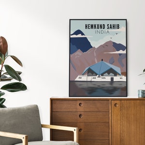 May include: A poster with a blue and white illustration of a building with a blue roof, surrounded by mountains and water. The text "HEMKUND SAHIB INDIA" is at the top of the poster.