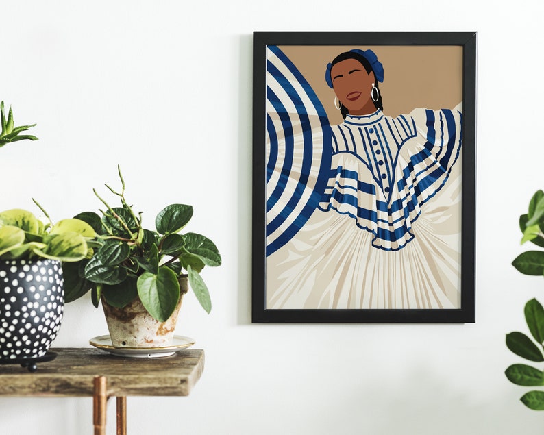 May include: A framed illustration of a woman wearing a white and blue striped dress with a large blue and white striped umbrella behind her. The background is a light brown colour.