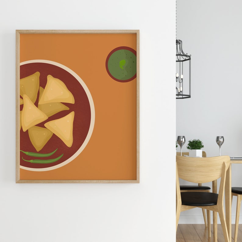 May include: A framed print of a plate of samosas with a side of green chutney. The plate is on a brown background with a small bowl of green chutney in the top right corner.