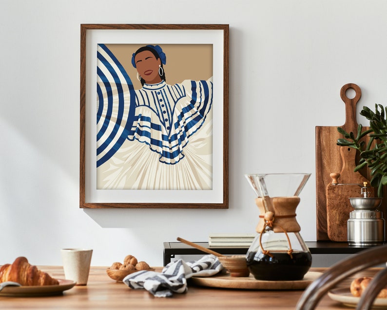 May include: A framed illustration of a woman wearing a white dress with blue and white stripes. The woman has dark skin, brown eyes, and is wearing blue earrings. The background is a light brown colour.